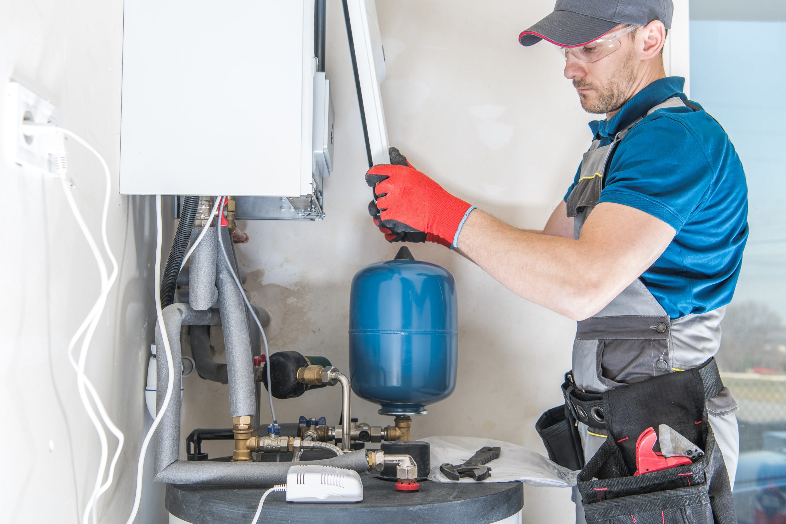 plumber installing gas hot water system
