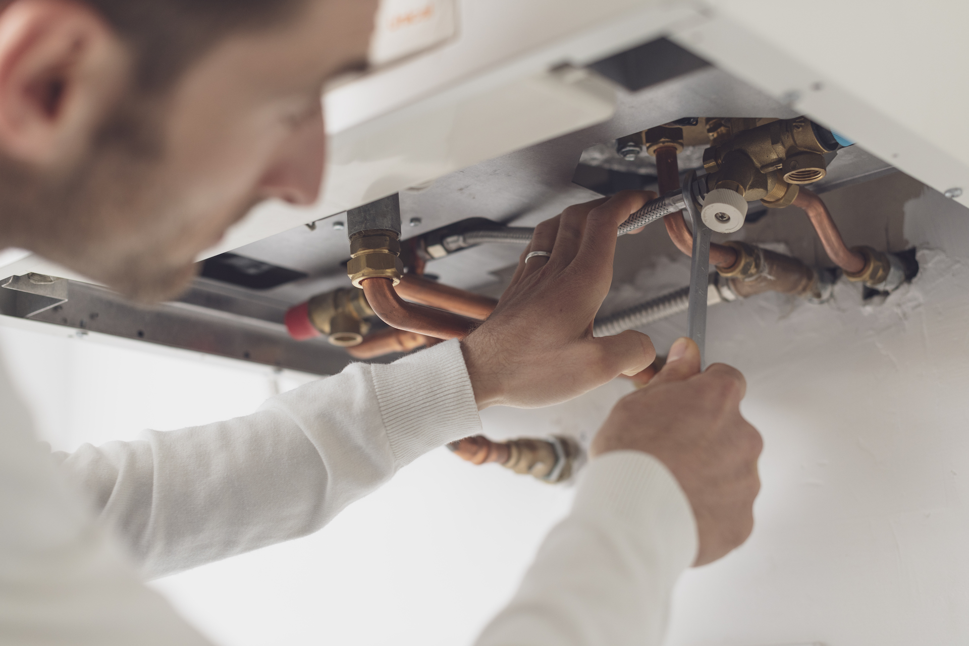 Plumber working on a hot water system